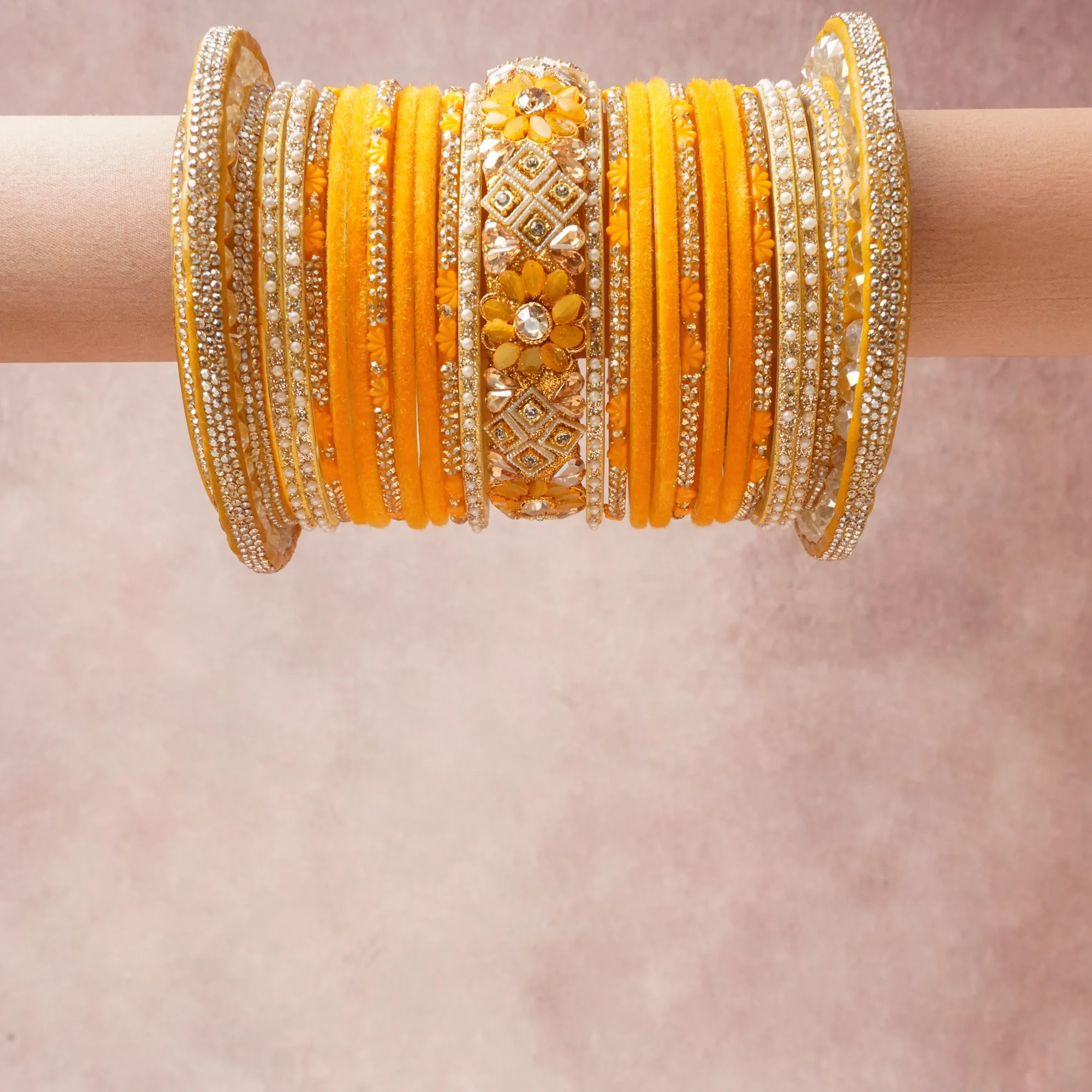A commanding Marigold Yellow anchors this beautiful set, enriched with accents of Crystal White, Gold, Ivory, Amber that add depth and dimension.

Featuring a striking composition of Velvet, Base Metal, Crystals, Faux Pearls, Glass, this set carries intricate craftsmanship and strong presence. Grand in form, it is created for moments that deserve to be marked.